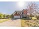 Charming two-story home with a well-manicured lawn and mature tree in a suburban neighborhood at 1542 Armende Cir, Dacula, GA 30019