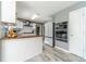 Contemporary kitchen with breakfast bar, modern appliances, wood countertops, and sleek finishes at 1542 Armende Cir, Dacula, GA 30019
