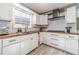 Modern kitchen featuring white cabinets, wood countertops, and stainless steel appliances at 1542 Armende Cir, Dacula, GA 30019