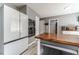 Stylish kitchen features a modern refrigerator, stainless steel appliances, and wood countertops at 1542 Armende Cir, Dacula, GA 30019