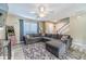 Inviting living room with a large gray sectional, a patterned rug, and plenty of natural light at 1542 Armende Cir, Dacula, GA 30019