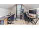 Office room with vaulted ceilings, carpeting, two modern computer setups, and a window view at 1542 Armende Cir, Dacula, GA 30019