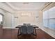 Elegant dining room with a modern chandelier, wainscoting, and large window at 2248 Fort Se Dr, Smyrna, GA 30080