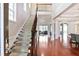 Bright foyer with hardwood floors, staircase, and high ceilings, offering a grand entrance at 2248 Fort Se Dr, Smyrna, GA 30080