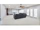 Spacious living room with projector screen, lots of windows, a ceiling fan and a comfortable sectional sofa at 2248 Fort Se Dr, Smyrna, GA 30080