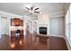 Spacious room featuring a fireplace, wood floors, and adjacent built-in desk at 2248 Fort Se Dr, Smyrna, GA 30080