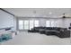 Spacious living room with projector screen, lots of windows, a ceiling fan and a comfortable sectional sofa at 2248 Fort Se Dr, Smyrna, GA 30080