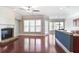 Bright living room featuring hardwood floors, a fireplace, and kitchen access at 2248 Fort Se Dr, Smyrna, GA 30080