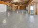 Unfinished basement with concrete floors and exposed ceiling and framing is ready for you to add your personal touches at 2470 Bridle Bridge Trl, Cumming, GA 30040