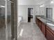 This primary bathroom features a soaking tub, walk-in shower, and double vanity at 2470 Bridle Bridge Trl, Cumming, GA 30040