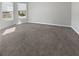 Well-lit bedroom with neutral carpet, large windows, and spacious layout at 2470 Bridle Bridge Trl, Cumming, GA 30040