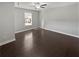 This bedroom is bright and features a ceiling fan, and hardwood floors at 2470 Bridle Bridge Trl, Cumming, GA 30040
