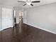 This bedroom has a ceiling fan, baseboard trim and doorway to other rooms at 2470 Bridle Bridge Trl, Cumming, GA 30040