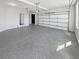 Garage with epoxy flooring and overhead door at 2470 Bridle Bridge Trl, Cumming, GA 30040