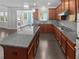 Spacious kitchen featuring granite countertops, stainless steel appliances, and hardwood floors at 2470 Bridle Bridge Trl, Cumming, GA 30040