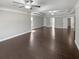 This expansive living room features hardwood floors, tray ceilings, and recessed lighting at 2470 Bridle Bridge Trl, Cumming, GA 30040