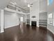 Bright living room with soaring ceilings, fireplace, and sleek hardwood floors at 2470 Bridle Bridge Trl, Cumming, GA 30040