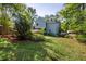 Expansive backyard with lush lawn, mature trees, and landscaping at 2634 Charlesgate Ave, Decatur, GA 30030