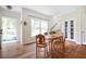 Bright dining area with hardwood floors, staircase, and large windows offering plenty of natural light at 2634 Charlesgate Ave, Decatur, GA 30030