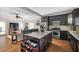 Open-concept kitchen with stainless steel appliances and dark wood cabinets at 2634 Charlesgate Ave, Decatur, GA 30030