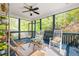 Screened porch with seating, plants and wood floors at 2634 Charlesgate Ave, Decatur, GA 30030