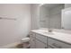 Well-lit bathroom with a marble countertop sink, white cabinets, and tile floors for a fresh, modern feel at 267 Eason St, Bowdon, GA 30108