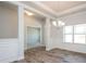 Traditional dining room featuring a modern chandelier and classic wainscoting at 267 Eason St, Bowdon, GA 30108