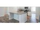 Kitchen island with granite countertops and stainless sink at 267 Eason St, Bowdon, GA 30108