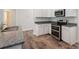 Kitchen with granite countertops, stainless appliances and decorative lighting at 267 Eason St, Bowdon, GA 30108
