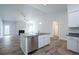Open floor plan featuring island, granite countertops and stainless steel appliances at 267 Eason St, Bowdon, GA 30108
