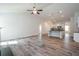 Living room and kitchen featuring an open floor plan and hardwood floors at 267 Eason St, Bowdon, GA 30108
