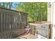 Outdoor patio area with shed, grill and privacy fence at 384 Parc River Blvd, Lawrenceville, GA 30046