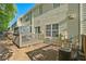 View of the backyard featuring a patio and air conditioning unit at 384 Parc River Blvd, Lawrenceville, GA 30046