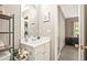 Modern bathroom with neutral color scheme, well-lit vanity, and open doorway at 384 Parc River Blvd, Lawrenceville, GA 30046