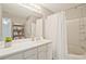 Bathroom featuring white vanity, large mirror, and a shower with a curtain at 384 Parc River Blvd, Lawrenceville, GA 30046
