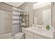 Bathroom with a shower-tub combination, modern vanity, and neutral decor at 384 Parc River Blvd, Lawrenceville, GA 30046