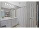 This bathroom features a shower/tub combo with a white shower curtain and a single sink vanity at 384 Parc River Blvd, Lawrenceville, GA 30046