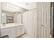 Well-lit bathroom with a white vanity and ample storage space at 384 Parc River Blvd, Lawrenceville, GA 30046