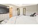 Bright bedroom featuring laminate floors, neutral walls, and an ensuite bathroom at 384 Parc River Blvd, Lawrenceville, GA 30046