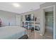 This bedroom features a bed, television, personal décor, and access to a full bathroom at 384 Parc River Blvd, Lawrenceville, GA 30046