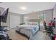This bedroom features a television, a closet, a window for natural light, and space for a desk at 384 Parc River Blvd, Lawrenceville, GA 30046