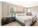 Cozy bedroom with stylish decor, large windows, and ample natural light at 384 Parc River Blvd, Lawrenceville, GA 30046
