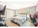 Cozy bedroom with light gray walls, modern laminate flooring, and a window view at 384 Parc River Blvd, Lawrenceville, GA 30046