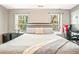Bedroom with large windows, comfortable bed, and contemporary decor at 384 Parc River Blvd, Lawrenceville, GA 30046
