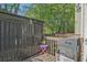 Cozy deck area with grill and storage at 384 Parc River Blvd, Lawrenceville, GA 30046