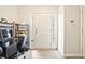 Bright foyer with hardwood-style flooring, a white front door, and office setup at 384 Parc River Blvd, Lawrenceville, GA 30046