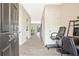 Welcoming foyer with light gray wood floors and access to an office space at 384 Parc River Blvd, Lawrenceville, GA 30046
