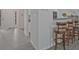 Open entryway flows into the kitchen, enhanced by a breakfast bar with wooden stools at 384 Parc River Blvd, Lawrenceville, GA 30046