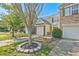 Street-side view of an inviting townhome with a single-car garage and landscaped front yard at 384 Parc River Blvd, Lawrenceville, GA 30046