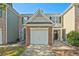 Charming townhome with single car garage, brick accents, and well-maintained landscaping at 384 Parc River Blvd, Lawrenceville, GA 30046